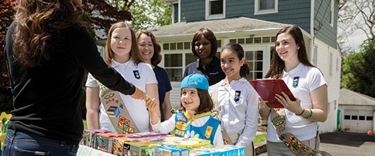 Girl Scouts selling cookies